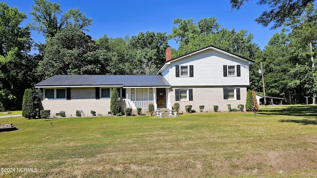 view of front of property with a front yard and a porch