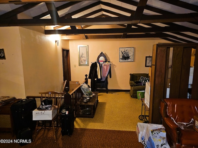 interior space featuring carpet and vaulted ceiling with beams