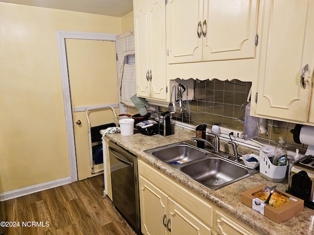 kitchen featuring dishwasher, dark wood-type flooring, and sink