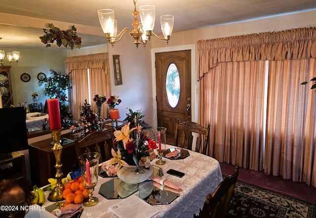 dining room with a notable chandelier