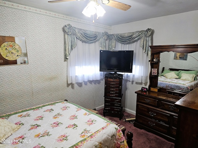 bedroom with dark colored carpet and ceiling fan