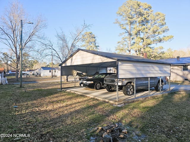 exterior space with a lawn and a carport