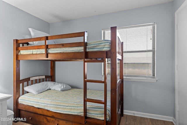 bedroom with hardwood / wood-style floors