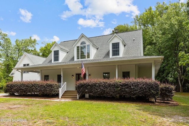 view of front of home featuring a porch and a front lawn