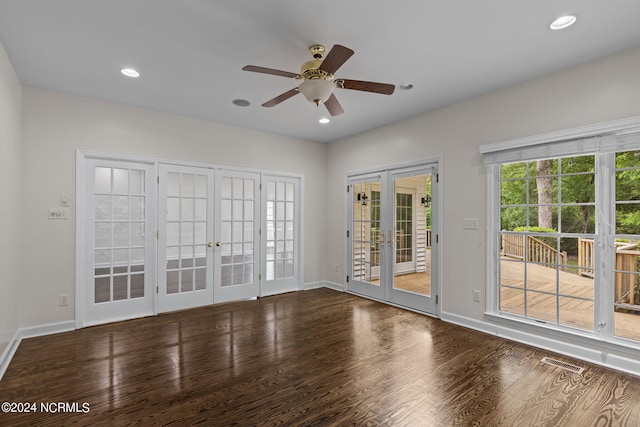 empty room featuring french doors, ceiling fan, and hardwood / wood-style floors