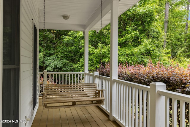 wooden terrace featuring a porch