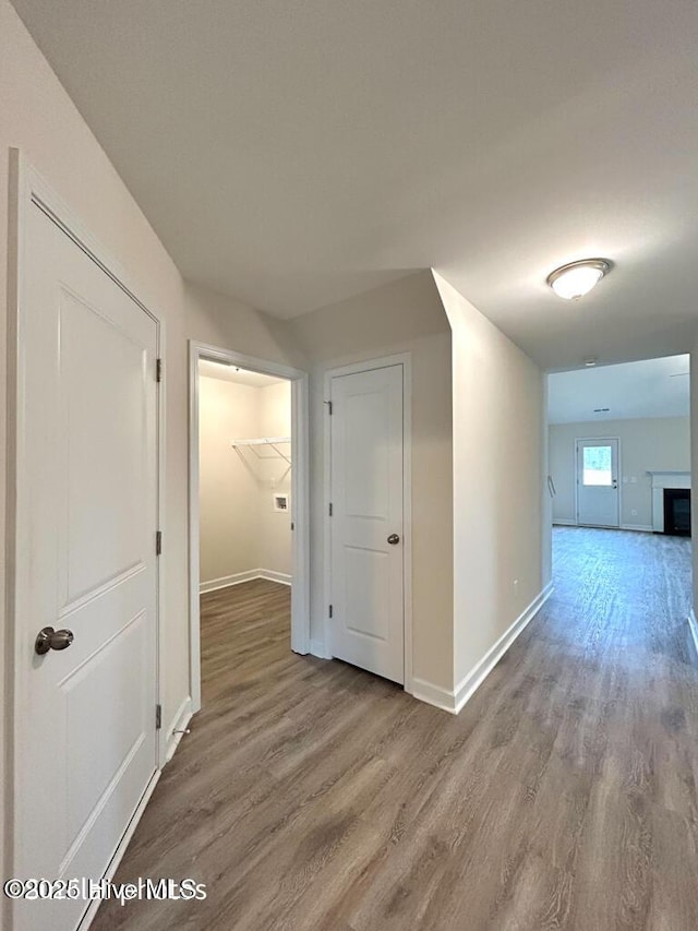 hall with wood-type flooring