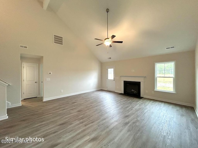 unfurnished living room featuring high vaulted ceiling, wood-type flooring, and ceiling fan