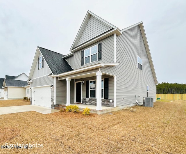 craftsman-style house with covered porch and a front lawn