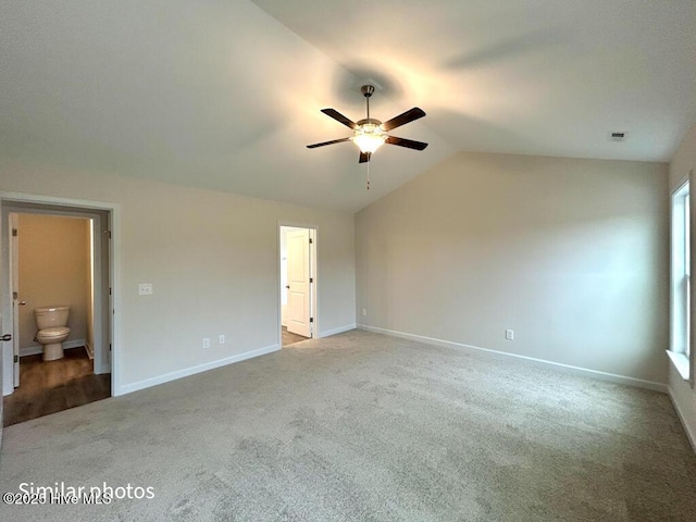 interior space featuring ceiling fan and vaulted ceiling