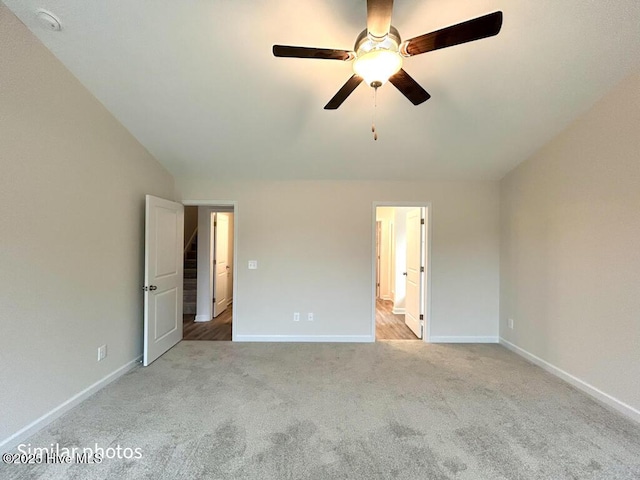 unfurnished bedroom featuring ceiling fan and light carpet