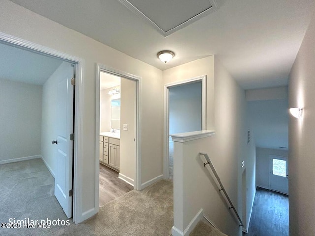 hallway with light carpet