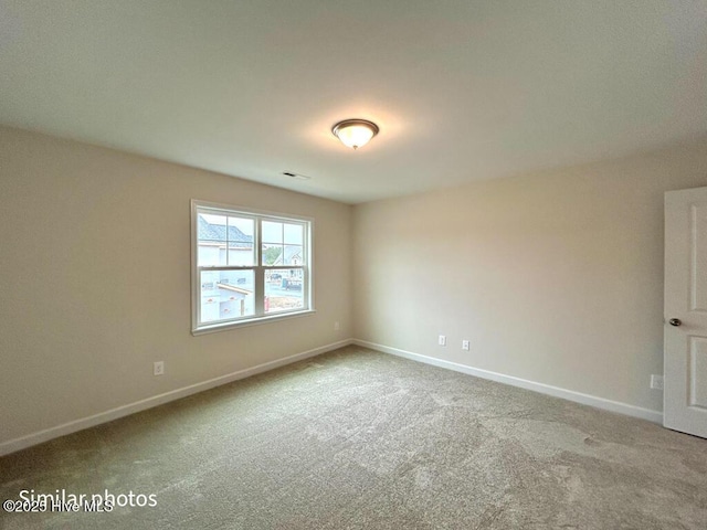 empty room featuring carpet flooring