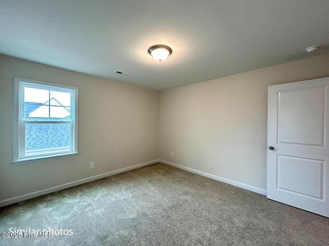 unfurnished room featuring carpet flooring