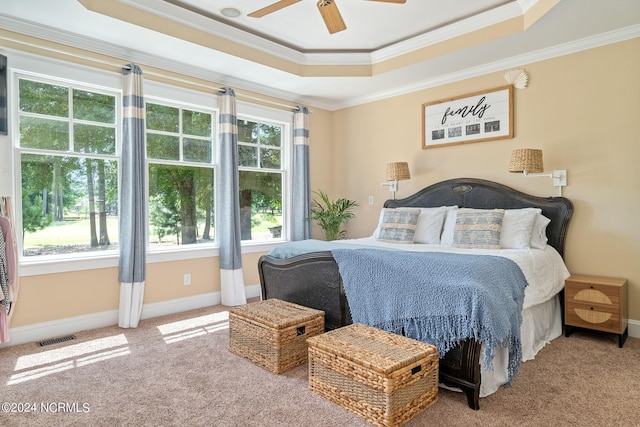 bedroom with carpet flooring, multiple windows, ceiling fan, and crown molding