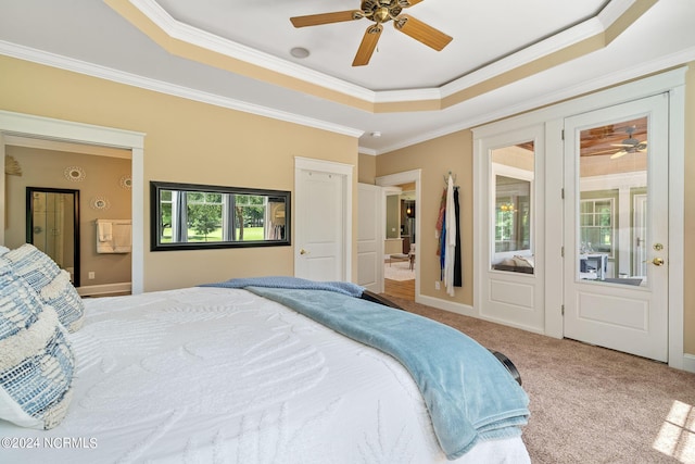 bedroom featuring carpet flooring, a raised ceiling, ceiling fan, and ornamental molding