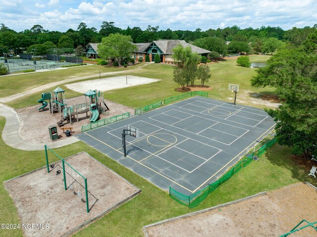 view of home's community with a playground, a lawn, and basketball court