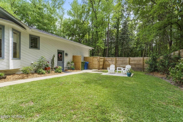 view of yard featuring a patio and fence