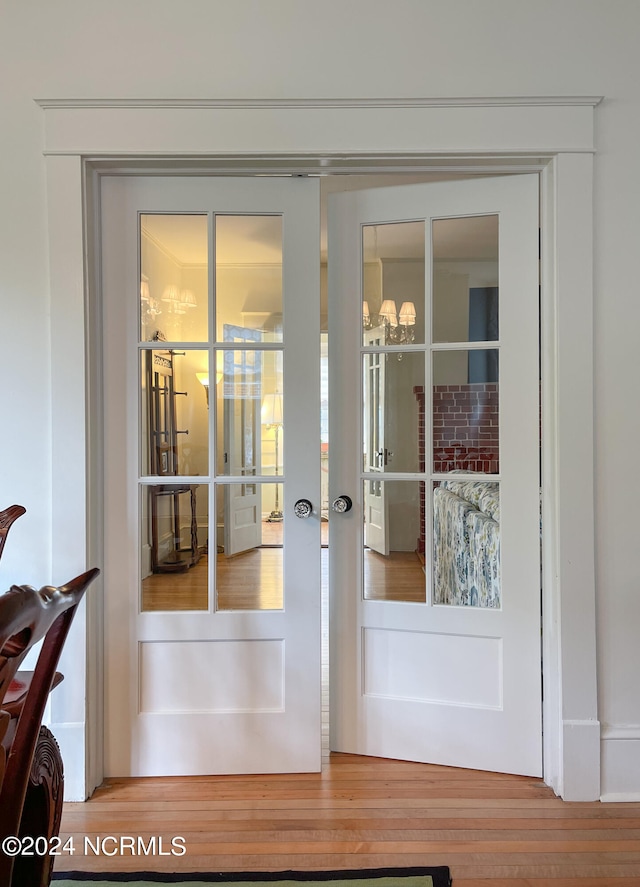 doorway to outside featuring wood-type flooring and french doors