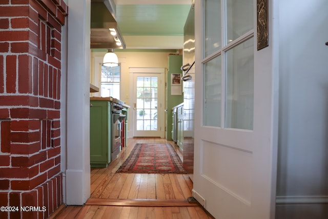 corridor with light hardwood / wood-style flooring