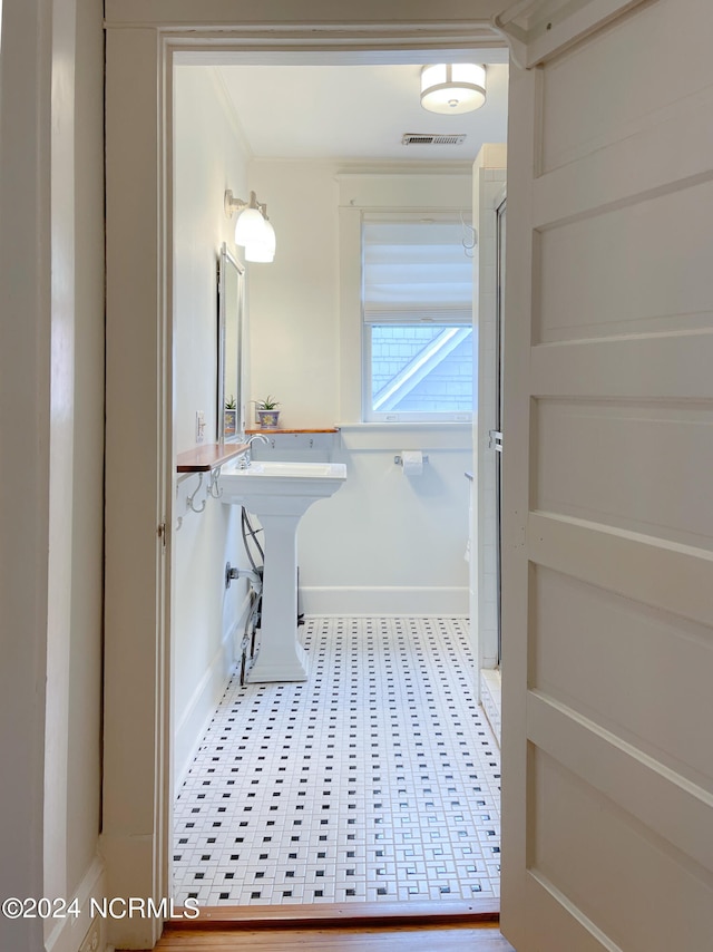 bathroom featuring tile flooring