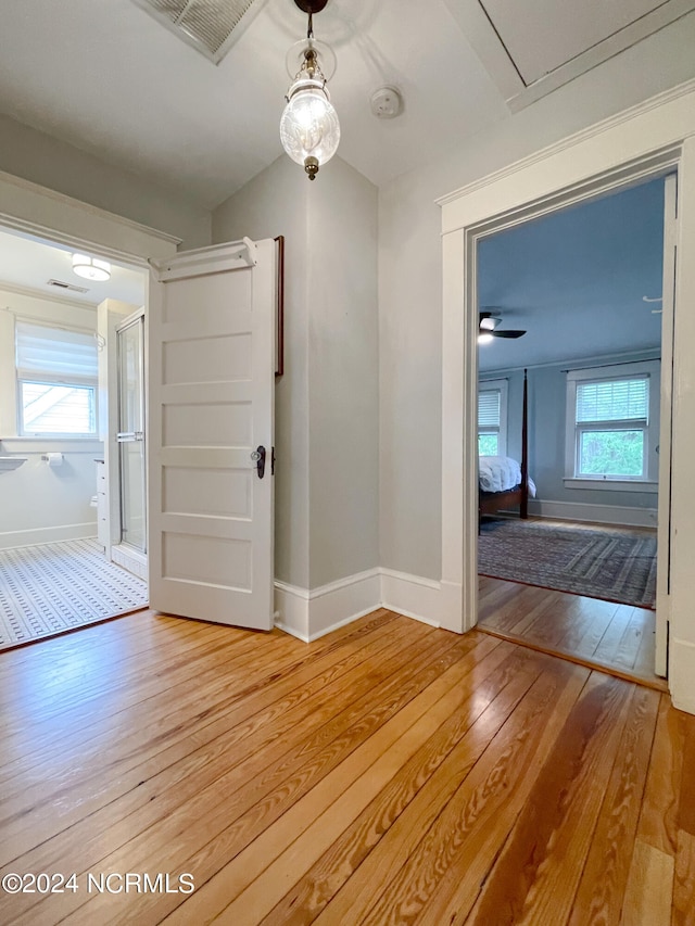 empty room featuring ceiling fan and hardwood / wood-style floors