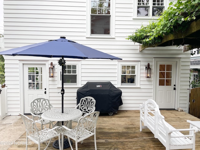 wooden deck featuring grilling area