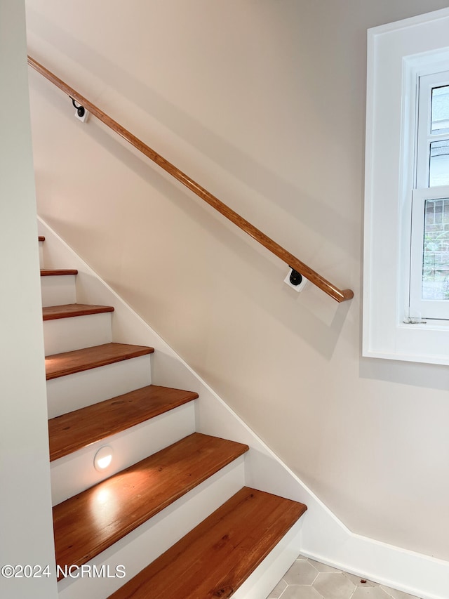 staircase with tile floors