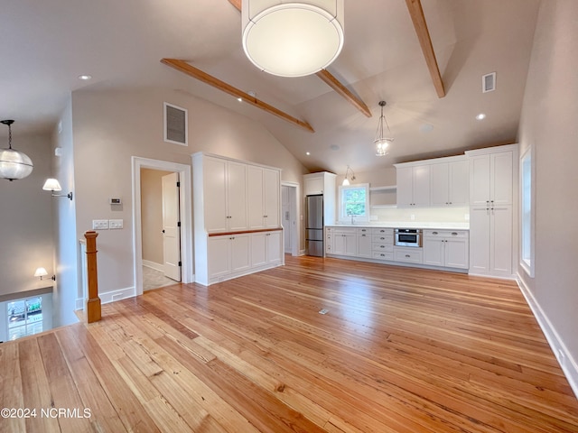 unfurnished living room with beamed ceiling, high vaulted ceiling, light wood-type flooring, and sink