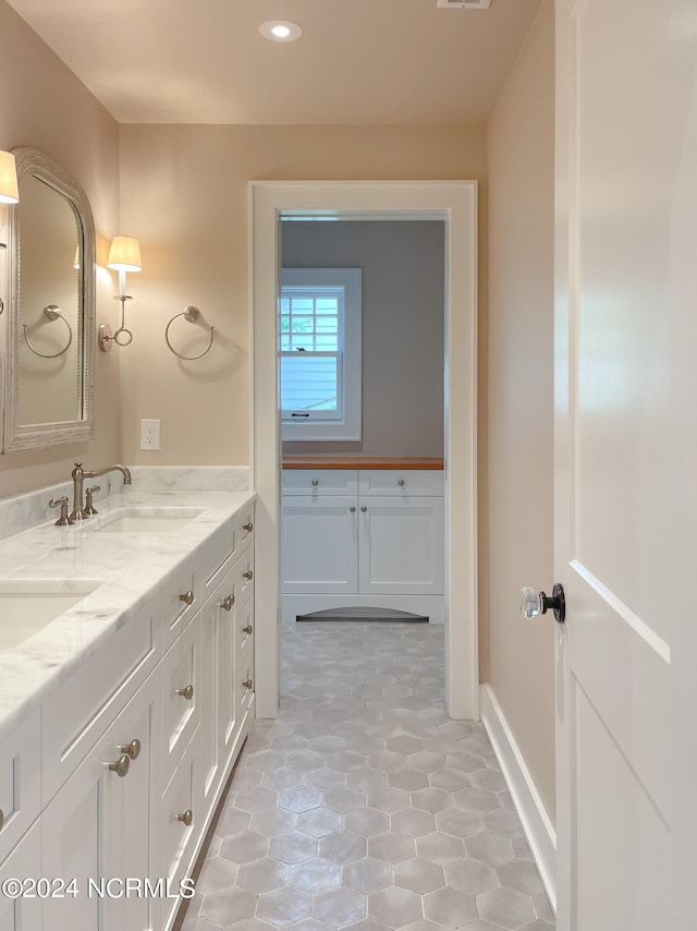 bathroom with tile flooring and oversized vanity