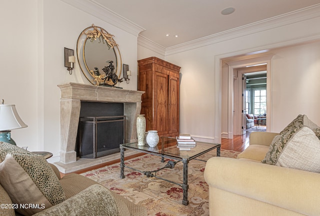 living room with ornamental molding and hardwood / wood-style floors