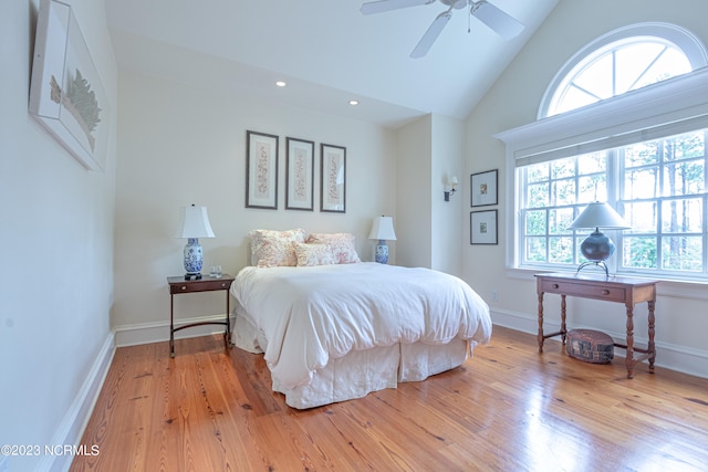 bedroom featuring lofted ceiling, ceiling fan, and hardwood / wood-style floors