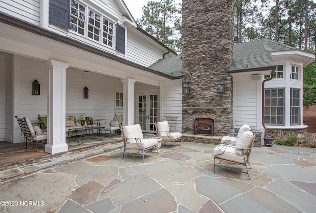 view of terrace featuring an outdoor living space with a fireplace