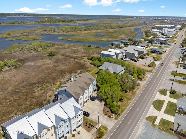 bird's eye view featuring a water view and a residential view