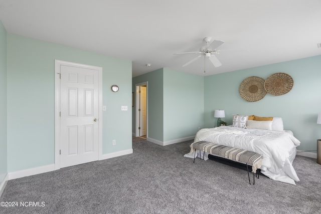 carpeted bedroom featuring a ceiling fan and baseboards