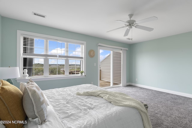 bedroom with ceiling fan, carpet flooring, visible vents, baseboards, and access to outside