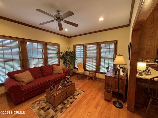 living area featuring recessed lighting, a ceiling fan, baseboards, ornamental molding, and light wood finished floors