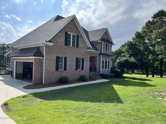 view of front of house featuring a garage and a front yard