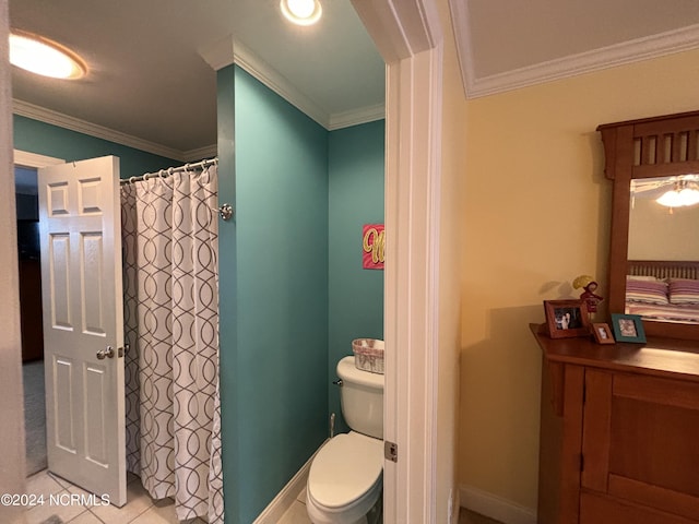 bathroom with ornamental molding, toilet, and tile patterned flooring