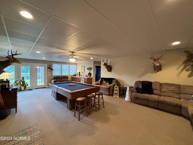 game room featuring light colored carpet, ceiling fan, a drop ceiling, and pool table