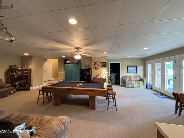 game room featuring a paneled ceiling, light carpet, ceiling fan, and pool table