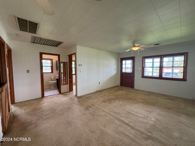 spare room with carpet and ceiling fan