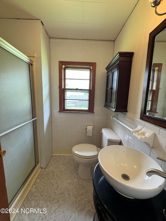 bathroom with tile flooring, tile walls, backsplash, sink, and toilet