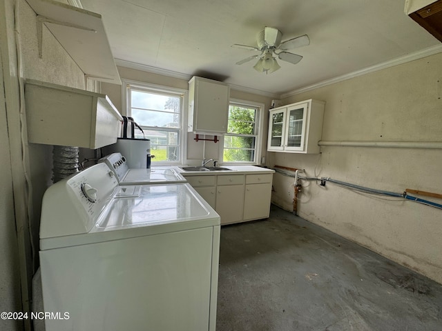 washroom with separate washer and dryer, cabinets, ornamental molding, sink, and ceiling fan