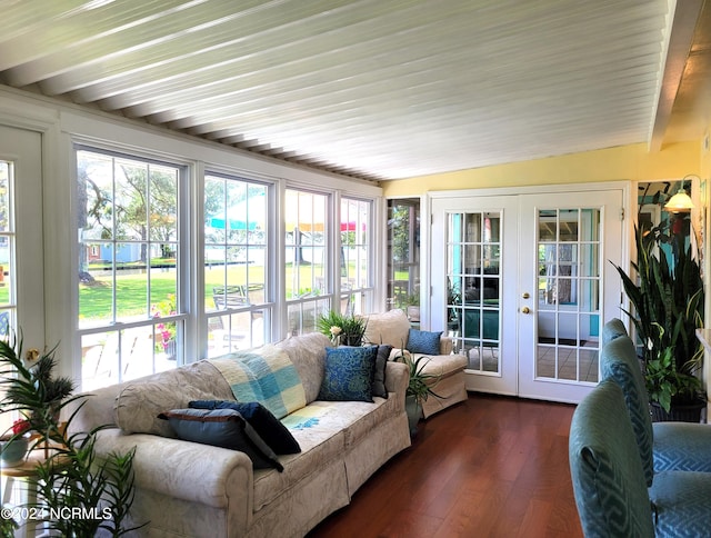 sunroom featuring french doors and lofted ceiling