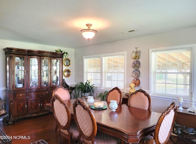 dining space with hardwood / wood-style flooring