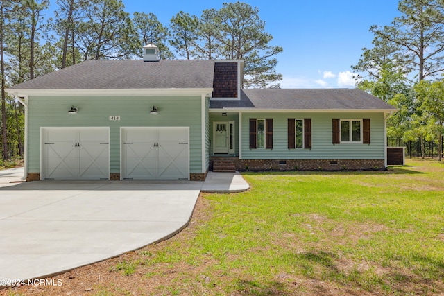 view of front of house featuring a garage and a front yard