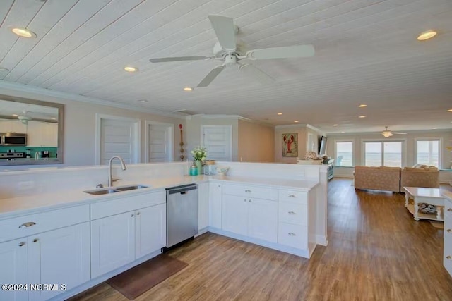 kitchen featuring appliances with stainless steel finishes, white cabinets, hardwood / wood-style floors, sink, and ceiling fan