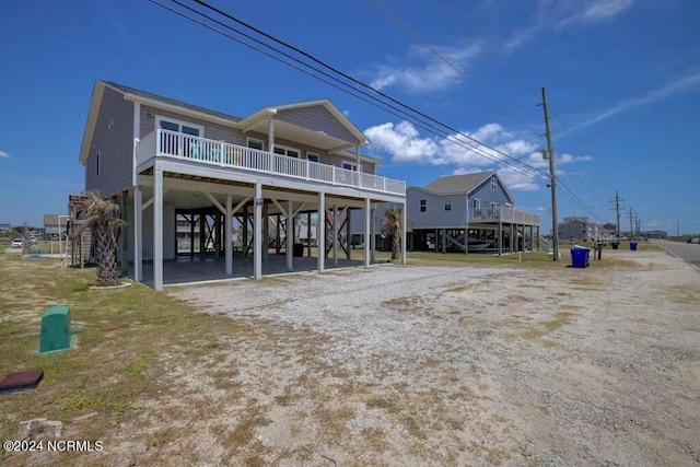 rear view of house featuring a carport