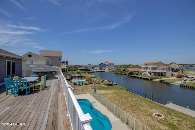 view of pool featuring a water view